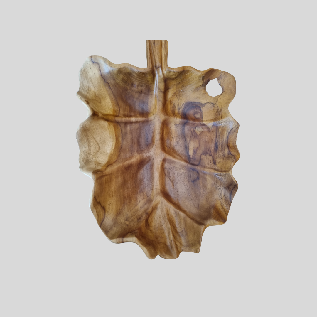 Wooden leaf-shaped serving tray  board on a light gray background