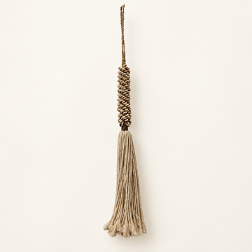 Braided cord with clustered cream pieces and long beige cotton fringe