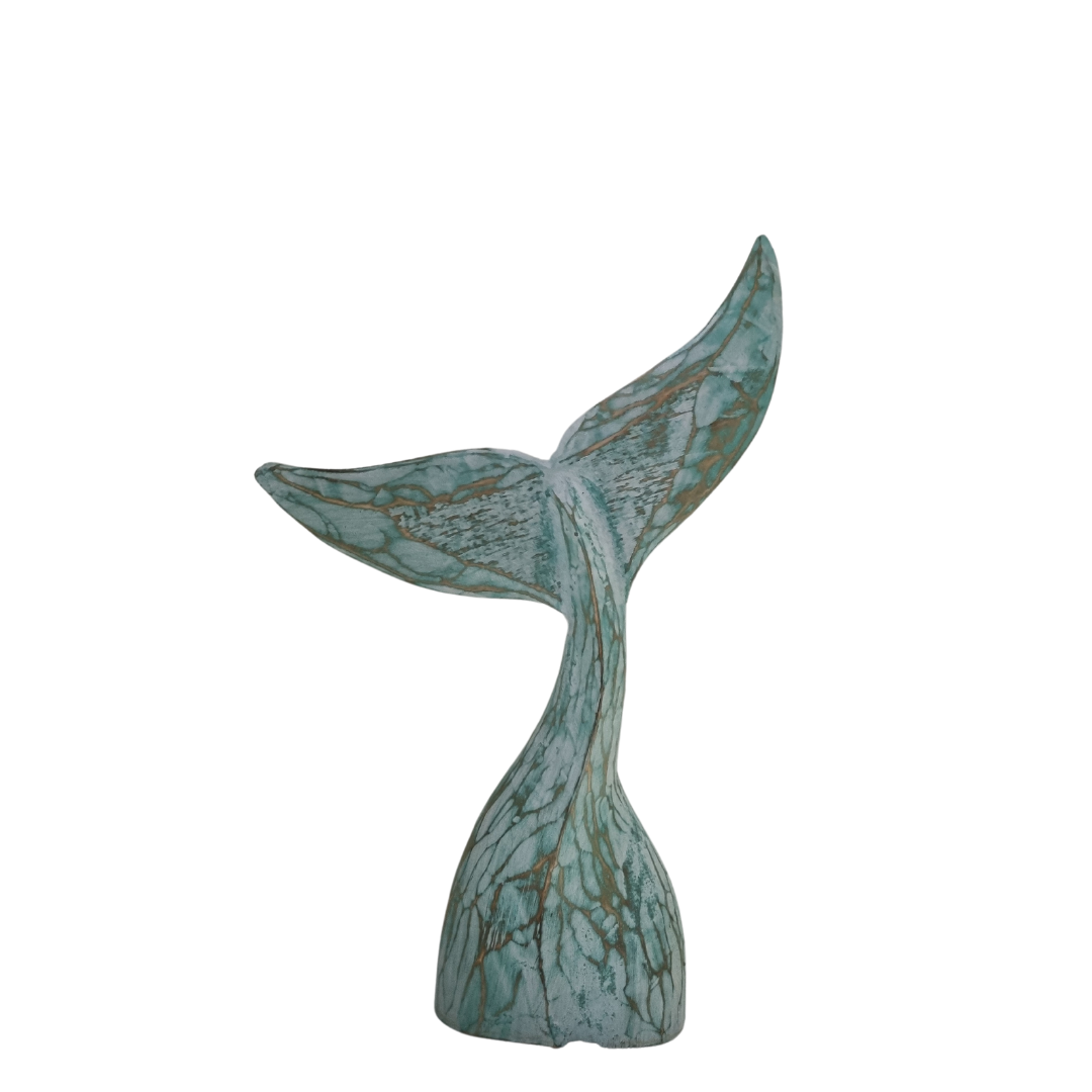 smaller style turquoise whale tail on a white back ground