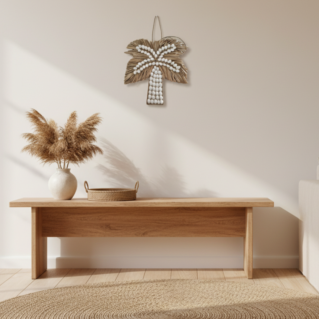 Small white shell and seagrass palm tree wall art styled in a coastal boho living room above a timber console. Size 21x21cm