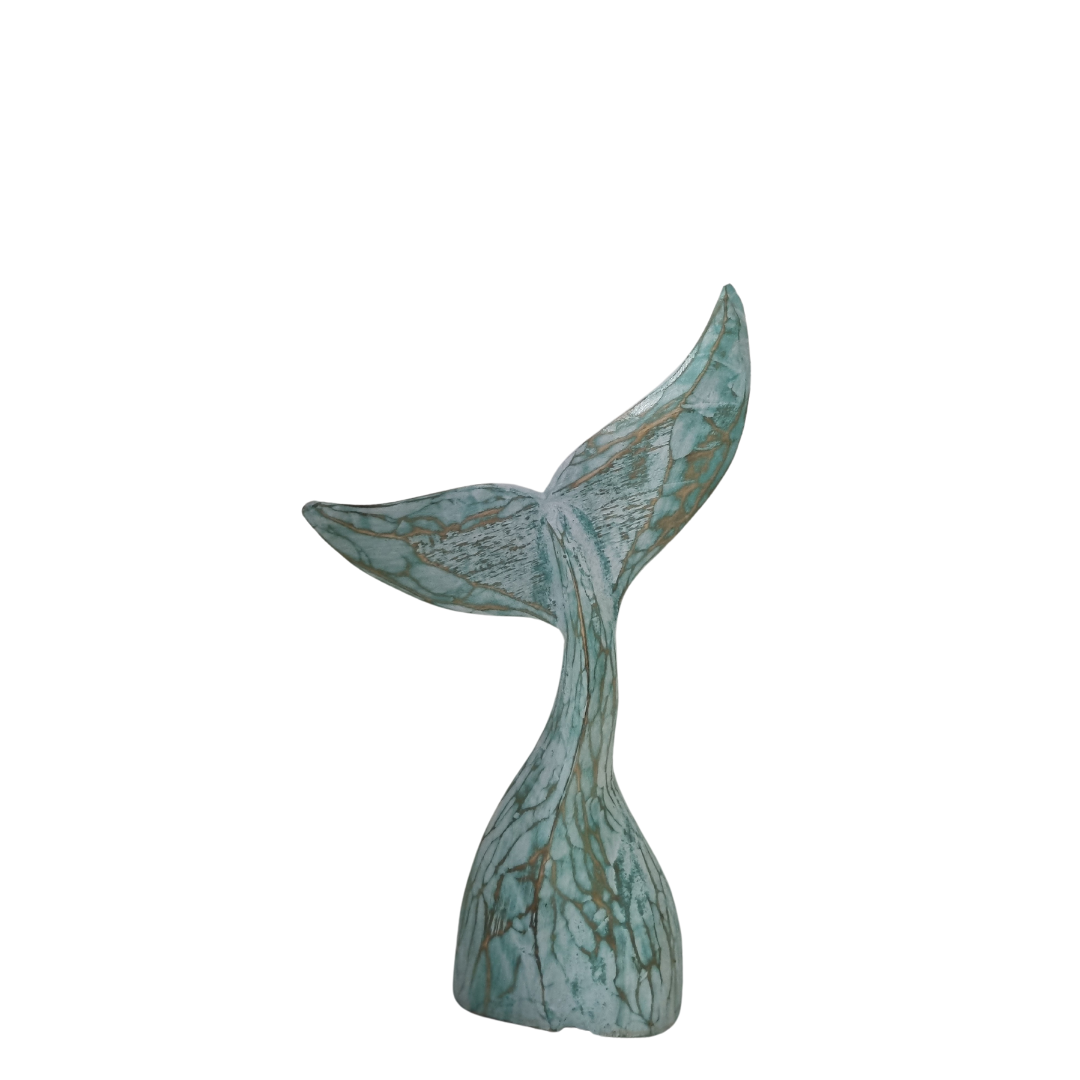 medium size wooden whale tail turquoise wash finish on a white back wall 