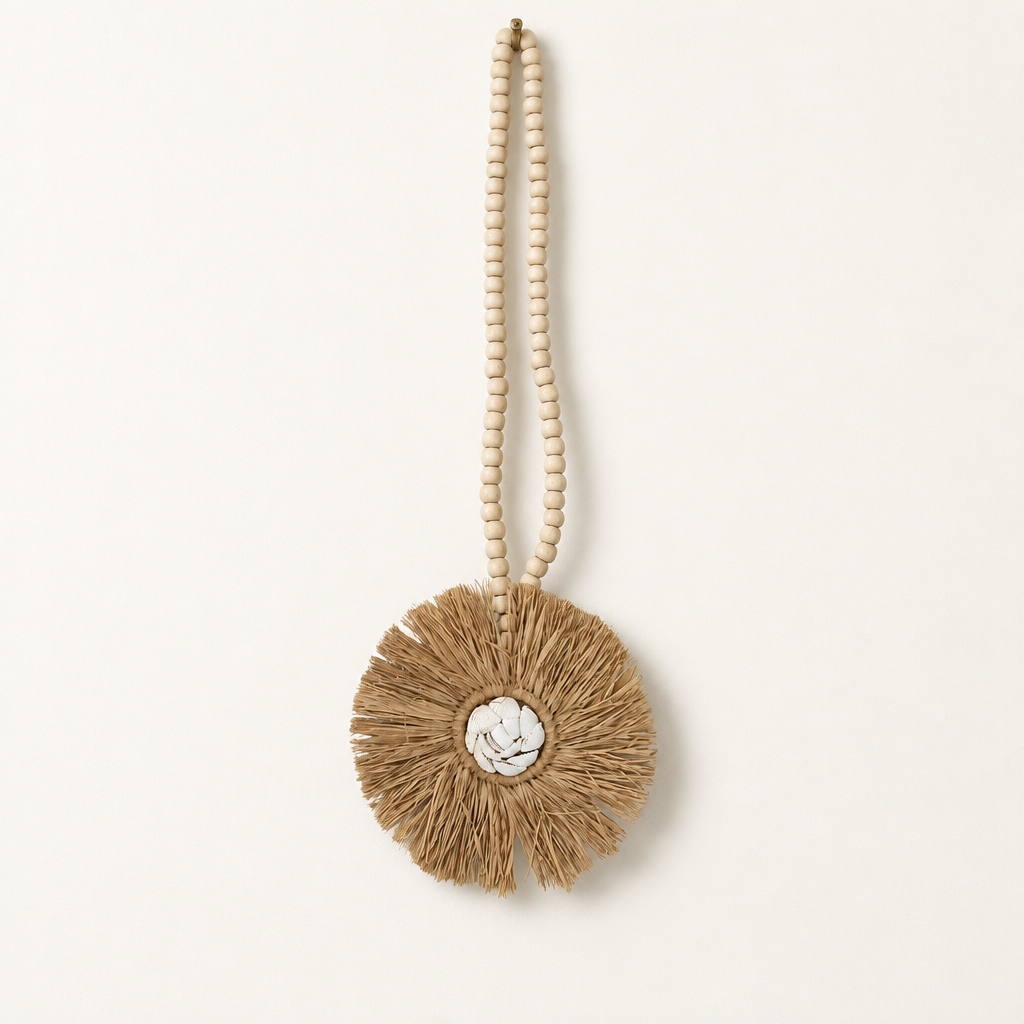Seagrass and shell wall hanging with a wooden bead loop and round natural fringe