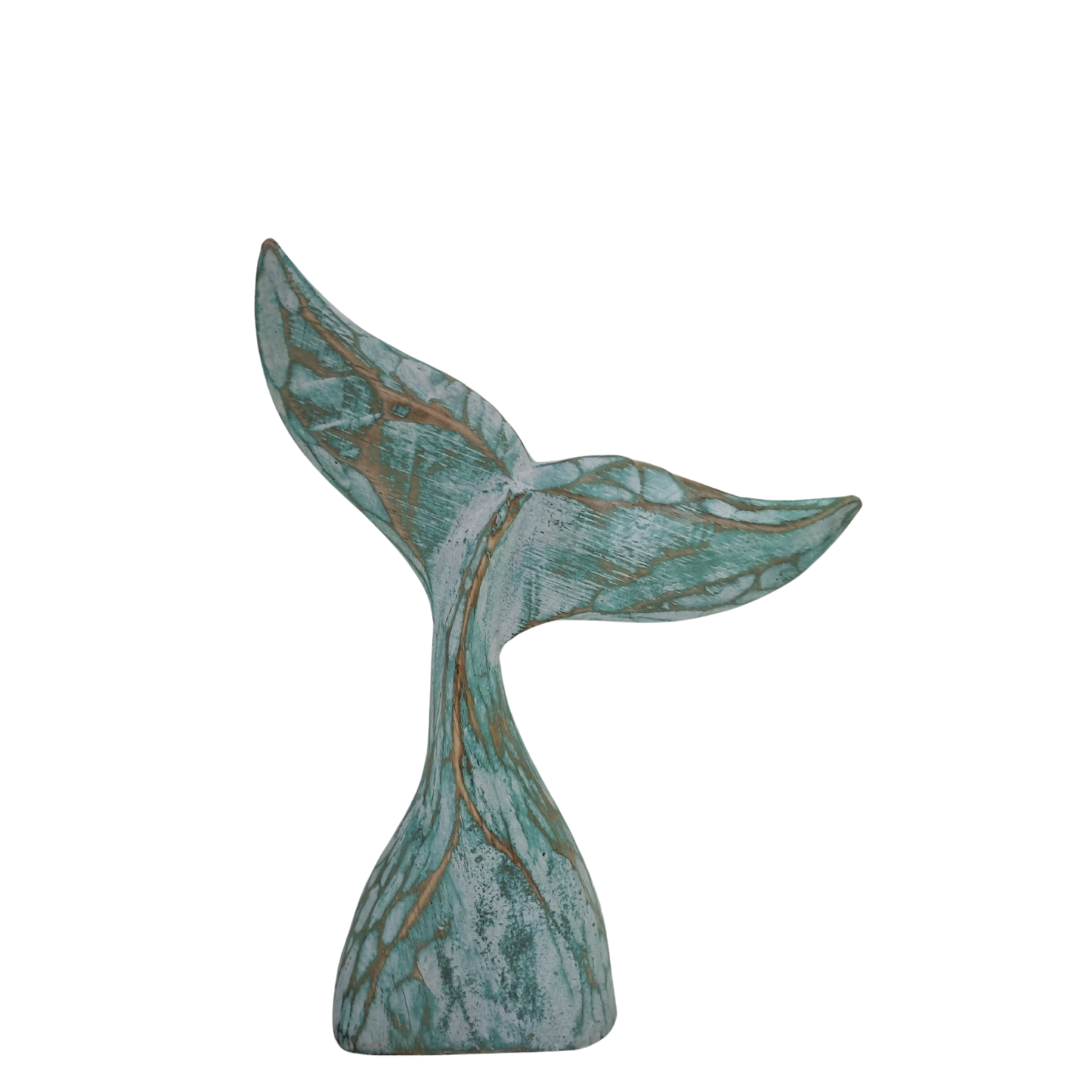 smaller style whale tail turquoise design  on a white back wall 