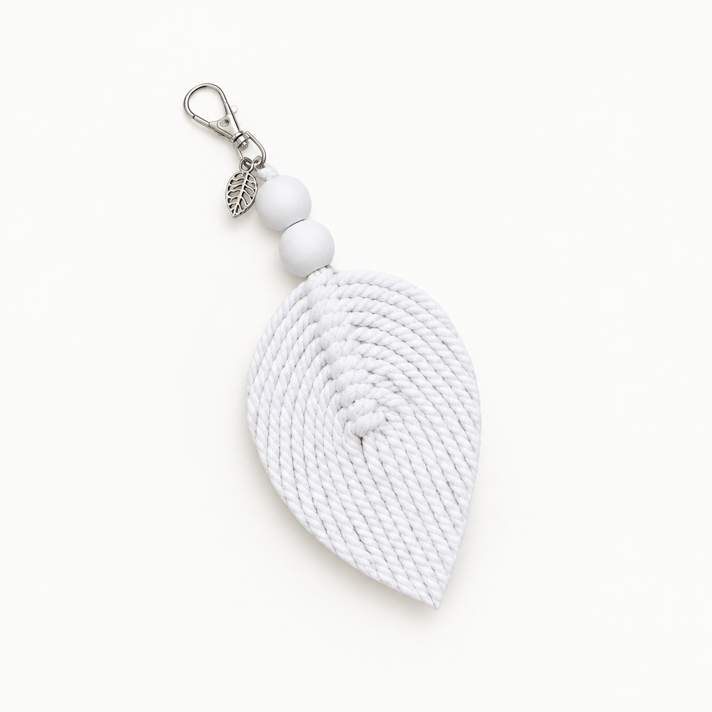 Macrame Leaf Key Ring or Hand Bag Décor A white woven rope leaf-shaped keychain or bag charm with three white beads and a silver lobster clasp, shown on a clean white background.