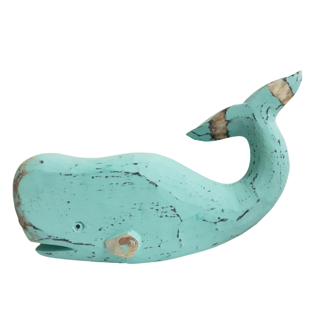A wooden carved whale decoration in turquoise color with a rustic finish.