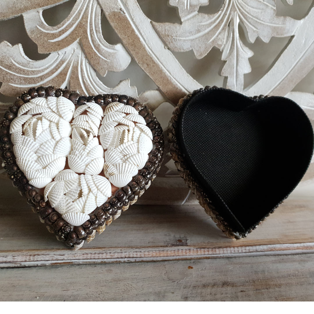 heart-shaped shell trinket box open revealing black material interior